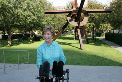 Mrs. Laura Bush addresses the media in the garden of the Nasher Sculpture Center at the conclusion of her tour of the new exhibit, Friday, Sept.19, 2008, in Dallas. Mrs. Bush said that the exhibit, which opened a few hours later, is in many ways about the relationships that Ray and Patsy Nasher had with the greatest artists of their generation - Picasso, Rodin, Oldenburg, Matisse and many others. The works had been in the Nasher home and are now at the center for enjoyment by the public.