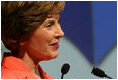 Mrs. Laura Bush address the White House Symposium on Advancing Global Literacy: Building a Foundation for Freedom, which convened at New York City's Metropolitan Museum of Art in New York City, Sept. 22, 2008. With a projection screen display to her side, Mrs. Bush noted that "literacy is at the core of sustainable solutions to the world's greatest problems." Worldwide more than 770 million adults live without literacy skills.