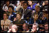 Mrs. Laura Bush listens from the audience as President George W. Bush delivers his address Tuesday, Sept. 23, 2008, to the United Nations General Assembly in at the U.N. Headquarters in New York City. Sitting with her from left are: Dr. Cheryl Benard, spouse of U.S. Ambassador to the United Nations Zalmay Khalilzad; Mrs. Yoo Soon-taek, spouse of U.N. Secretary-General Ban Ki-moon, and Mrs. Carla Bruni Sarkozy, spouse of French President Nicolas Sarkozy.