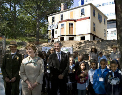 Mrs. Laura Bush stands with children from the Adam Clayton Powell Jr. Elementary School (P.S. 153) and the Boys and Girls Club of Harlem as she addresses media after participating in a First Bloom program at the Hamilton Grange National Memorial in New York City, Sept. 24, 2008. The plantings are part of the restoration efforts at the historic home of Alexander Hamilton.