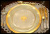 The George W. Bush State China, unveiled Wednesday, Jan. 7, 2009, at the White House by Mrs. Laura Bush, has a gold rim with a green basket-weave pattern and a historically-inspired gold eagle throughout the 14-piece place setting. The 320-place setting pattern will allow the White House to accommodate larger Rose Garden dinners and cover any breakage. The china was paid for by the White House Historical Association Acquisition Trust, a non-profit organization.