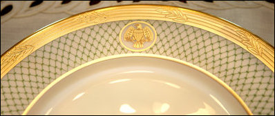 The rim of the George W. Bush State China, unveiled Wednesday, Jan. 7, 2009, at the White House by Mrs. Laura Bush, shows the two distinctive design elements of the china – a green basket-weave pattern and a historically-inspired gold eagle – throughout the 14-piece place setting. The new 320-place setting china will allow the White House to accommodate larger Rose Garden dinners and cover any breakage. The china was paid for by the White House Historical Association Acquisition Trust, a non-profit organization.