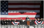 President George W. Bush addresses his remarks in honor of his father, former President George H. W. Bush, at the commissioning ceremony of the USS George H. W. Bush (CVN 77) aircraft carrier Saturday, Jan 10, 2009 in Norfolk, Va.