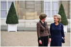 Mrs. Laura Bush visits with Madame Beradette Chirac outside the Elysee Palace during the International Centre for Missing and Exploited Children Meeting Wednesday, Jan. 17, 2007. 