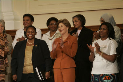 Laura Bush stands with U.S. Ambassador to South Africa Jendayi Frazer, left, during her visit to Centre for the Book, an institution established to create a culture of literacy in South Africa, Tuesday, July 12, 2005, in Cape Town. 