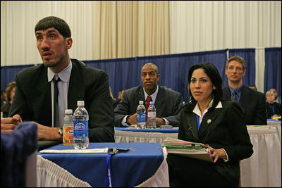 Representatives of the National Basketball Association, former NBA player Gheorghe Muresan, left, NBA players Jerome Vernon WIlliams, background-left, and Detlef Schrempf, background-right, now retired, attend the the White House Conference on Helping America's Youth, Thursday, Oct. 27, 2005 at Howard University in Washington. White House staff member Sonya Medina is seen at right.
