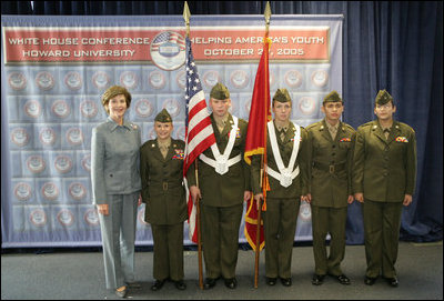Laura Bush poses with the Young Marines Color Guard, Thursday, Oct. 27, 2005 at Howard University in Washington, during the White House Conference on Helping America's Youth. 