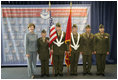 Laura Bush poses with the Young Marines Color Guard, Thursday, Oct. 27, 2005 at Howard University in Washington, during the White House Conference on Helping America's Youth. 