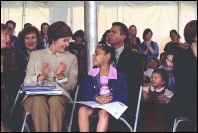 Laura Bush applauds at the end of a reading by renowned children's author and illustrator, Eric Carle, Saturday, October 12, 2002 at the Second Annual National Book Festival on the held on the west side of the Capitol.