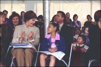 Laura Bush applauds at the end of a reading by renowned children's author and illustrator, Eric Carle, Saturday, October 12, 2002 at the Second Annual National Book Festival on the held on the west side of the Capitol. White House photo by Susan Sterner. 