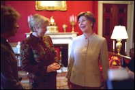 Laura Bush shares a light moment with Ludmila Putina, wife of Russian Federation President Vladimir Putin, in the Red Room of the White House the Saturday, October 12, 2002 prior to the opening ceremony of the Second Annual National Book Festival. White House photo by Susan Sterner.