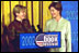 Laura Bush welcomes Ludmila Putina, wife of Vladimir Putin, President of the Russian Federation, to the Second Annual National Book Festival Saturday, October 12, 2002 in the East Room of the White House. Standing with the First Ladies on stage are, left to right, Native American poet Lucy Tapahoso, writer Mary Higgins Clark, Librarian of Congress James Billington, and NBA player Jerry Stackhouse. White House photo by Susan Sterner.