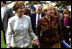 Laura Bush and Ludmila Putina, wife of Russian Federation President Vladimir Putin, stroll across the lawn of the Capitol visiting the tents of authors and story tellers at the Second Annual National Book Festival Saturday, October 12, 2002. 