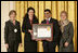 Mrs. Laura Bush along with Dr. Anne Radice, the Director of the Institute of Museum and Library Services, right, presents a 2007 National Awards for Museum and Library Services awards to both Nancy Stueber, Director, and Priyam Shah, Community Representative of the Oregon Museum of Science & Industry, Portland, OR, during a ceremony in the East Room at the White House Monday, January 14, 2008. "Regular visitors to OMSI can touch a tornado, uncover a fossil, experience an earthquake, visit the Northwest's largest planetarium, explore a Navy submarine, or just experiment on their own in one of eight hands-on labs." Mrs. Bush said of the Oregon Museum of Science & Industry during her remarks.
