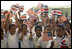 Students wave Costa Rican and American flags during Mrs. Bush's visit to their school, Escuela de los Estados Unidos, in San Jose, Costa Rica, Monday, May 8, 2006. 