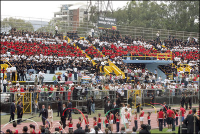 People sitting in the pattern of the Costa Rican flag fill the stands as President-elect Oscar Arias walks in a procession as part of his inaugural ceremony at the Estadio Nacional in San Jose, Costa Rica, Monday, May 8, 2006.