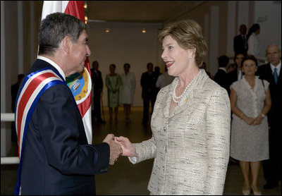 After the inauguration ceremony, Mrs. Laura Bush greets President Oscar in San Jose, Costa Rica, Monday, May 8, 2006. "Today I had the opportunity to convey to President Arias the United States' strong support and partnership with Costa Rica," said Mrs. Bush in a statement to the press. "We have a history of a long friendship, and I'm very, very happy to have been the one to get to give him the very best wishes of the American people."