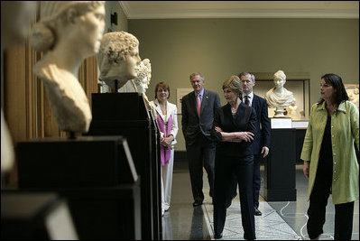 Mrs. Laura Bush walks through the Women of Antiquities exhibit Saturday, April 28, 2007, during a visit to the Getty Villa in Malibu, Calif. Mrs. Bush made the visit after delivering the commencement address to the 2007 graduates of Pepperdine University's Seaver College. She's joined by Dr. Karol Wight, right, Acting Curator of Antiquities at the J.Paul Getty Museum; Mrs. Louise Bryson, Chair of the J.Paul Getty Board of Trustees; Brad Freeman, second from left, longtime Bush family friend, and Dr. Michael Brand, Director of the J.Paul Getty Museum.
