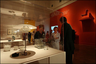 Visiting the Corcoran Gallery of Art, Mrs. Laura Bush and Mrs. Maria Kaczynska, First Lady of Poland, look at Poul Henningsen's table lamp, “PH", during a tour of the exhibit Modernism: Designing a New World, 1914-1939, Monday, July 16, 2007, in Washington, D.C. They are led by Director and President Paul Greenhalgh and Administrative Design Chair Catherine Armour.