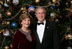 Celebrating the 2007 holiday season, President George W. Bush and Mrs. Laura Bush pose in front of the Christmas Tree in the Blue Room of the White House.