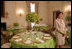 Mrs. Laura Bush discusses the motifs and entertainment for the official dinner honoring His Excellency Junichiro Koizumi, Prime Minister of Japan, in the State Dining Room during a media preview Thursday, June 29, 2006. "I think it's going to be a very fun evening," said Mrs. Bush. "Our orchestra is the Brian Setzer Orchestra. He'll play a lot of both the President's and Prime Minister Koizumi's favorites, and he's especially known for his guitar. So I think that will be terrific." White House photo by Shealah Craighead 