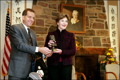 John Long, Chairman of the Board of Directors, Pearl S. Buck International, presents Mrs. Laura Bush with the 2006 Pearl S. Buck Woman of the Year award Tuesday, October 24, 2006, at the Pearl S. Buck House in Perkasie, Pennsylvania. The Pearl S. Buck award is given to honor women who make outstanding contributions in the areas of cross-cultural understanding, humanitarian outreach, and improving the life and expanding opportunities for children around the world. White House photo by Shealah Craighead 