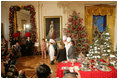 Mrs. Laura Bush and White House Chef Cris Comerford, center, explain the holiday reception menu to the press in the State Dining Room Thursday, Nov. 30, 2006. White House photo by Shealah Craighead 