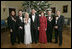 President George W. Bush and Mrs. Laura Bush stand with the Kennedy Center honorees in the Blue Room of the White House during a reception Sunday, Dec. 3, 2006. From left, they are: singer and songwriter William "Smokey" Robinson; musical theater composer Andrew Lloyd Webber; country singer Dolly Parton; film director Steven Spielberg; and conductor Zubin Mehta. White House photo by Eric Draper 