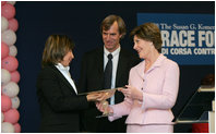 Mrs. Laura Bush presents the first Komen Italia Award, Thursday, Feb. 9, 2006 to Mrs. Marisa Giannini, a cancer survivor and the director of the Philatelic division of the Italian Postal Service, for her volunteer services with Koman Italia of The Susan G. Komen Breast Cancer Foundation. White House photo by Shealah Craighead 