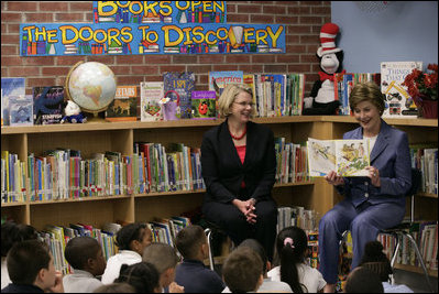 Mrs. Laura Bush, joined by U.S. Secretary of Education Margaret Spellings, reads to children at the Driggs School in Waterbury, Conn., Tuesday, July 24, 2007. Mrs. Bush also announced the 2007 Improving Literacy through School Libraries grants being awarded by the U.S. Department of Education.