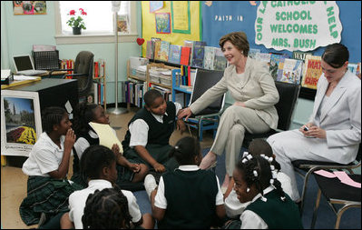 Mrs. Laura Bush talks with students during her visit to Our Lady of Perpetual Help School in Washington, Monday, June 5, 2006, where she announced a Laura Bush Foundation for America's Libraries grant to the school. Mrs. Bush is joined by Our Lady of Perpetual Help fifth grade teacher Julie Sweetland, right.