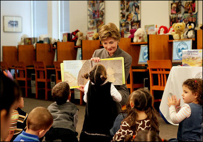 A little reader takes a closer look as Mrs. Laura Bush reads the children's book, "I Love You, Little One," by Nancy Tafuri during a visit to the Jenna Welch and Laura Bush Community Library in El Paso, Texas, Wednesday, Oct. 18, 2006. Since the library opened in 2003, the number of programs and attendance has tripled. Through the past year, the Library hosted 349 programs for more than 10,000 participants.