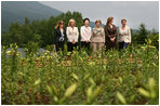 With Mt. Yoteizan as a backdrop, Mrs. Laura Bush and the G8 spouses pause Tuesday, July 8, 2008, for a photo in the village of Makkari, known for its lilies and potatoes, on the northern Japanese island of Hokkaido. From left are Mrs. Margarida Uva Barosso, wife of the President of European Commission; Mrs. Laureen Harper, wife of the Prime Minister of Canada; Mrs. Kiyoko Fukuda, wife of the Prime Minister of Japan; Mrs. Laura Bush; Mrs. Sarah Brown, wife of the Prime Minister of the United Kingdom; and Mrs. Svetlana Medvedeva, wife of the President of Russia.