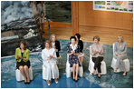 Mrs. Bush participates in a discussion at the Volcano Science Museum with Junior 8 (J8) members and other G8 spouses during her visit to the Toyako Town Visitors Center Wednesday, July 9, 2008, in Japan. J8 is a UNICEF-sponsored initiative begun four years ago to give kids, ages 13 to 17 from the G8 and developing countries, a way to meet and work together on the issues that affect them and to discuss their concerns with the G8 leaders. At the museum with Mrs. Bush are, from left, Mrs. Sarah Brown, spouse of the Prime Minister of the United Kingdom; Mrs. Svetlana Medvedeva, spouse of the President of Russia; Mrs. Kiyoko Fukuda, spouse of the Prime Minister of Japan; and Mrs. Laureen Harper, spouse of the Prime Minister of Canada.