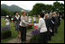Mrs. Laura Bush, accompanied by Mrs. Kiyoko Fukuda, spouse of the Prime Minister of Japan, left, is greeted at Toyako's New Mount Showa Memorial Park where she participated in a tree planting ceremony with other G8 spouses on Wednesday, July 9, 2008, in Hokkaido, Japan.