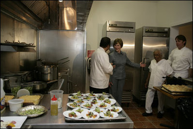 Mrs. Laura Bush tours the new kitchen at Willie Mae’s Scotch House Thursday, April 19, 2007, in New Orleans, La. The restaurant was destroyed in Hurricane Katrina. Pictured with Mrs. Bush are, from left, Willie Mae’s grandson Ronnie Seaton, Sr., 93-year-old Willie Mae Seaton, and Chef John Besh of Restaurant August.