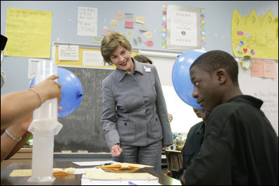 Mrs. Laura Bush watches a student demonstrate an experiment with static electricity and a balloon at the New Orleans Charter Science and Mathematics High School Thursday, April 19, 2007, in New Orleans, La. Originally created as a half-day program in 1992, the program reorganized itself as The New Orleans Charter Science and Mathematics High School after Hurricane Katrina sent the city’s school system into a state of crisis.