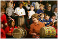 Mrs. Laura Bush joins in a musical number playing a drum with children at the Louisiana Children’s Museum in New Orleans, Tuesday, Jan. 9, 2007, during her visit to see the rebuilding progress in the Gulf Coast region. The museum, closed nearly a year following the 2005 hurricanes, is working to address the needs of young children and families seeking a safe and nurturing environment. White House photo by Shealah Craighead 