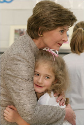 Mrs. Laura Bush receives a farewell hug from a young child at a Boys & Girls Club program Thursday, Feb. 22, 2007 at the D’Iberville Elementary School in D’Iberville, Miss. White House photo by Shealah Craighead 