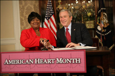 President George W. Bush shakes the hand of Joyce Cullen, a heart disease survivor, after signing the Presidential Proclamation in Honor of American Heart Month Friday, Feb. 1, 2008, in Kansas City, Mo. In signing the proclamation, the President thanked Mrs. Cullen for her work and said, "...She's very much a part of the Heart Truth Campaign here in Kansas City. And she's helping people understand two things -- one, be able to recognize the symptoms, and secondly, be able to prevent the symptoms from happening in the first place... So I want to thank you for being a strong leader in the campaign for awareness."