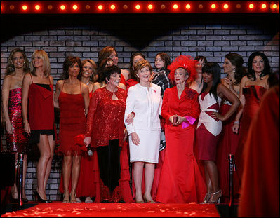 Mrs. Laura Bush is joined by singer/actress Liza Minnelli, left, her fellow celebrities, and fashion models participating in The Heart Truth Red Dress Collection 2008 fashion show in New York, Friday, Feb. 1, 2008. Heart Truth is a national awareness campaign that warns women of the dangers of heart disease.