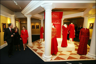 Duke Blackwood, Director of the Ronald Reagan Presidential Library and Museum, guides Mrs. Laura Bush and Mrs. Nancy Reagan on a tour of the Red Dress Exhibit at the Ronald Reagan Presidential Library and Museum Wednesday, Feb. 28, 2007, in Simi Valley, Calif. The exhibit features red dresses and suits worn by America’s First Ladies who have joined the Heart Truth campaign to raise awareness of heart disease as the 