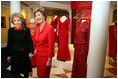 Mrs. Laura Bush and Mrs. Nancy Reagan pose for a photo during a tour of the Red Dress Exhibit at the Ronald Reagan Presidential Library and Museum Wednesday, Feb. 28, 2007, in Simi Valley, Calif. The exhibit features red dresses and suits worn by America’s First Ladies who have joined the Heart Truth campaign to raise awareness of heart disease as the 