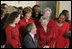 President George W. Bush and Laura Bush joke with heart disease survivors after signing the American Heart Month Proclamation in the East Room Feb. 2, 2003.