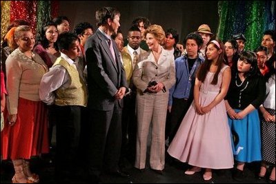 Laura Bush meets members of the Will Power to Youth program after watching their rendition of "Romeo and Juliet" at the Shakespeare Festival/LA in Los Angeles April 26, 2005. The program recruits children living below the poverty level to create their own versions of Shakespeare's plays, while paying them for their work and offering tutoring opportunities.