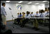 Mrs. Laura Bush listens to Team Focus class participants Thursday, June 21, 2007, in Mobile, Ala., share their personal stories in the "Yesterday, Today, Tomorrow" class during a visit to Team Focus's National Leadership Camp, as part of Helping America's Youth initiative. To fatherless young men, Team Focus offers mentoring services such as summer academic programs, leadership camps, year-round mentoring and scholarships and college counseling.