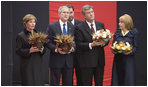 Carrying bowls of corn with candles, President George W. Bush and Mrs. Laura Bush and Ukraine President Viktor Yushchenko and Mrs. Kateryna Yushchenko visit the Holomodor Memorial in Kyiv Tuesday, April 1, 2008. The memorial honors victims of Ukraine's great famine of 1932.