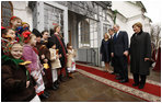 President George W. Bush and Mrs. Laura Bush, joined by Ukrainian President Viktor Yushchenko and his wife, first lady Kateryna Yushchenko, are greeted by children, April 1, 2008, before touring St. Sophia's Cathedral in Kyiv, Ukraine.