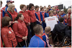 Mrs. Laura Bush holds a T-shirt presented to her Sunday, April 6, 2008, by members of the Russian Paralympic team at Central Sochi Stadium in Sochi, Russia.