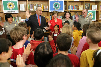 Mrs. Laura Bush and Interior Secretary Dirk Kempthorne swear in new Junior Rangers, students at Balboa Magnet Elementary School Wednesday, Feb. 28, 2007, in Northridge, Calif. The National Park Service Junior Ranger program provides activities in parks and partnering schools to teach young people about America's National Parks. White House photo by Shealah Craighead 